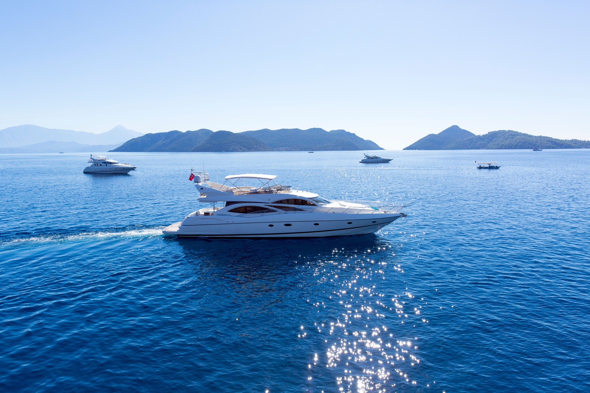 Aerial view of luxury yacht sailing on the sea